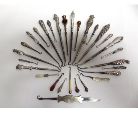 A COLLECTION OF BUTTON, GLOVE & OTHER HOOKS   some with silver tops, the smallest 4.25cm and the largest 42.5cm long, contain