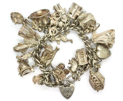 925 silver charm bracelet, with twenty five charms, combined 109g. P&amp;P Group 1 (£14+VAT for the first lot and £1+VAT for 