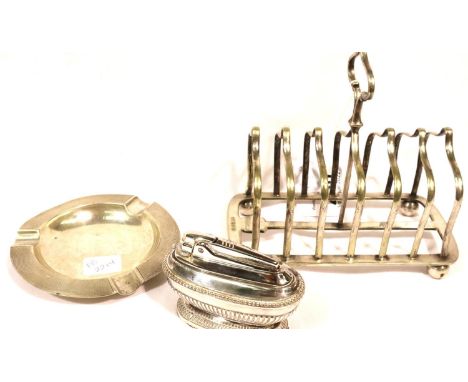 Hallmarked silver ashtray, London assay, 70g, a silver plate toast rack and a Ronson chrome table lighter. P&amp;P Group 1 (£