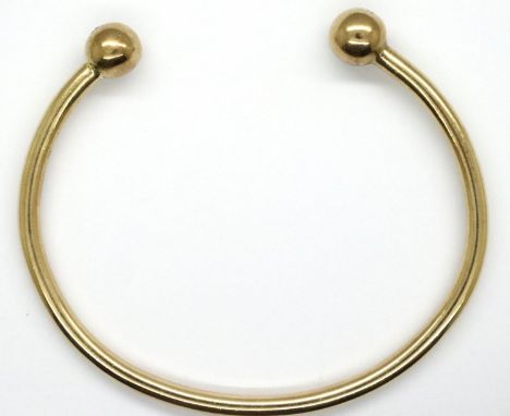 9ct gold diamond set bangle, L: 80 mm, 36.7g. No chips/scratches to diamonds, small scratches to bangle only visible with lou