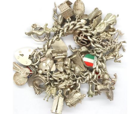 Heavy silver charm bracelet, L: 13 cm, combined 139g. P&amp;P Group 1 (£14+VAT for the first lot and £1+VAT for subsequent lo