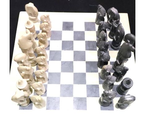 Hand carved soapstone complete chess set and board, King H: 13 cm. P&amp;P Group 2 (£18+VAT for the first lot and £3+VAT for 