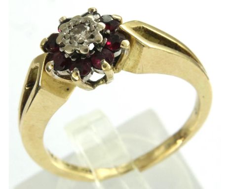 18ct gold ruby and diamond flower ring, size P/Q, 5.2g. P&amp;P Group 1 (£14+VAT for the first lot and £1+VAT for subsequent 