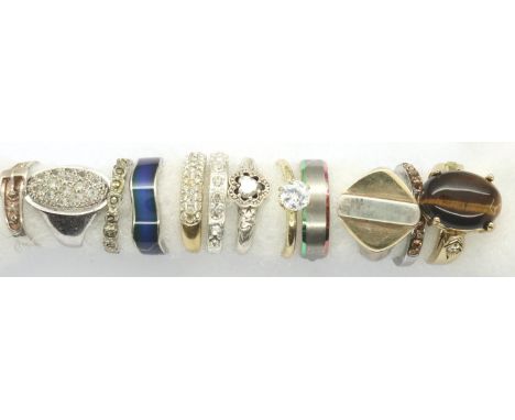 Twelve white and yellow metal rings, mixed sizes. P&amp;P Group 1 (£14+VAT for the first lot and £1+VAT for subsequent lots) 