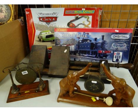 TWO DECORATIVE DINNER GONGS, LARGE WOODEN CARPENTER'S CLAMP, DISNEY CARS MICRO SCALEXTRIC ETC.There are no trains included wi