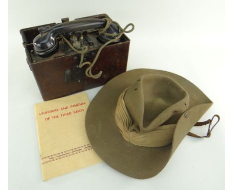 GERMAN WWII FIELD TELEPHONE &amp; THIRD REICH MANUAL together with a WWII period hat (3)