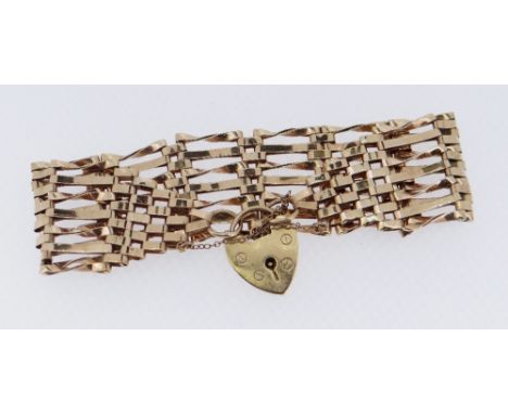 9CT GOLD SEVEN BAR GATE BRACELET, 16.1gms