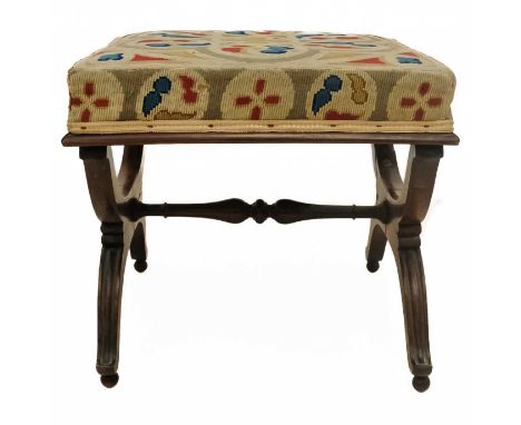 A Regency rosewood stool. With embroidered top, raised on curved X supports united by a turned stretcher, height 44cm, the to