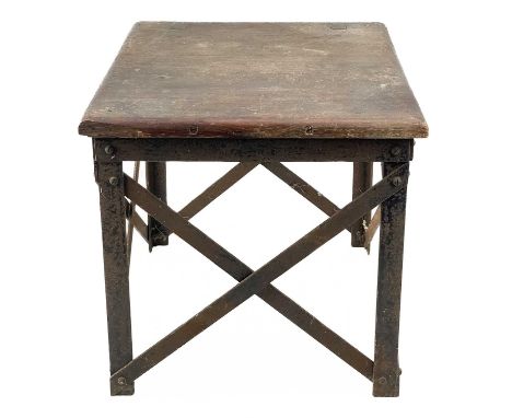 An early 20th century oak stool. With iron strap work frame base, height 32cm width 34cm depth 33.5cm.