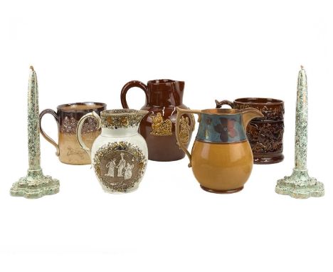 A pearlware jug. Circa 1840, printed in brown with Brittania and other figures, within a floral border, height 13.5cm, togeth