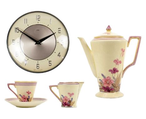 An Adderley Ware Art Deco coffee set. With floral painted decoration, and comprising a coffee pot and cover, cream jug, and s