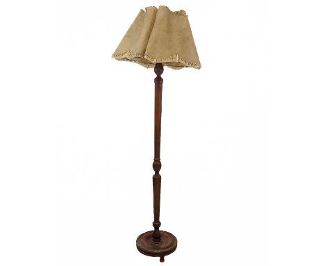 A decorative turned and painted standard lamp. First half 19th century, with a marbled finish on a red and gilt ground, with 