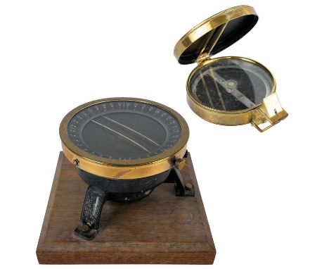 A brass prismatic surveyor's compass by Francis Barker & Sons Ltd. Dated 1932, diameter 13.5cm, together with a Victor US arm