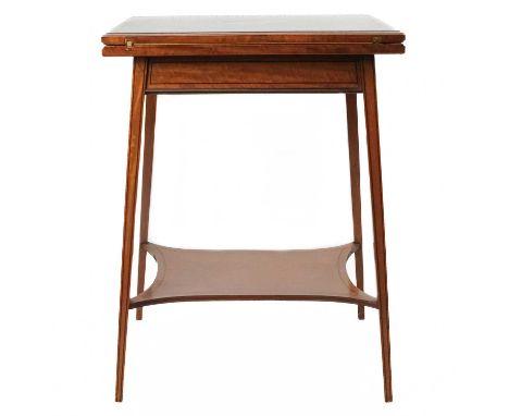 An Edwardian satinwood inlaid fold over swivel card table. With ebony stringing and inlaid decoration of musical instruments 