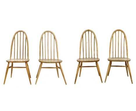 Four light oak hoop back Ercol chairs With tapering turned supports. (4)Heavy wear, staining and scratches, joints are firm a
