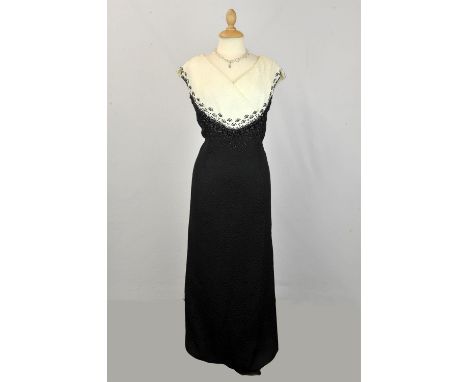 Two long 1950s original evening gowns. One in monochrome heavily beaded crepe-de-chine with a silk lining UK12-14 and the oth