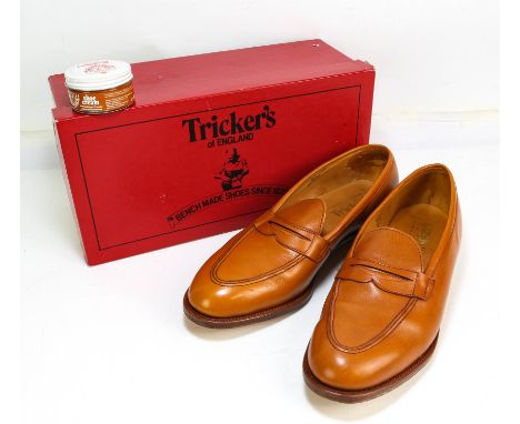 A pair of quality gents unworn boxed, hand bench-made Penny Loafers by TRICKERS (RRP £480) in light tan leather with leather 