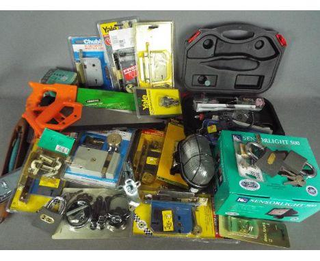 Lot to include hand tools, electric screwdriver, security light, door locks, padlocks and similar.