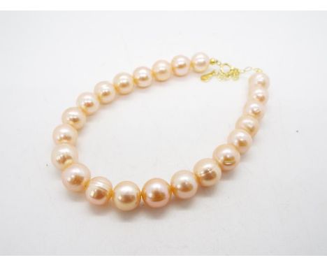 A natural coloured Pink Fresh Water Cultured Pearl bracelet, stone size 8 mm x 8.50 mm set with gold plated sterling silver, 