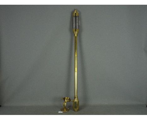 A brass cased marine stick barometer, the silvered dial marked Russell Norwich, with gimbal wall mount, approximately 93 cm. 