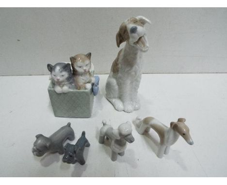 Six Nao Ceramic Figures. Dogs and Cats. Tallest is 17cm high. 