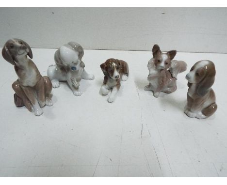 Lladro - Five Dog Ceramic Figures. Tallest is 11cm high.