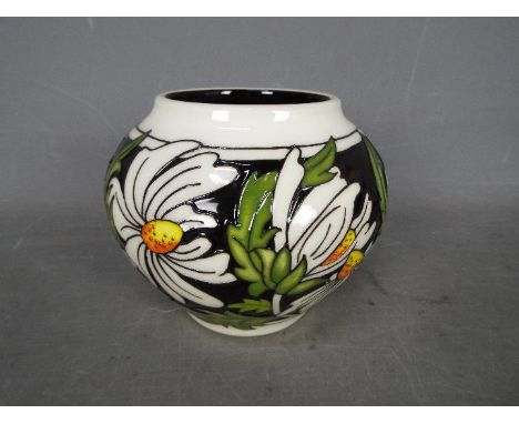 Moorcroft -  a ceramic Moorcroft vase decorated in the Phoebe pattern, 11 cm (h)