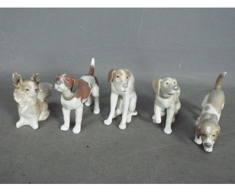 Lladro - Five Ceramic Dog Figures. Tallest is 10cm high.