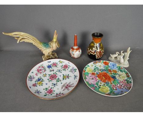 A small ceramics groups to include Chinese plates, Portuguese bird figurine, Gouda Pottery Nadro pattern vase, Nao bird group