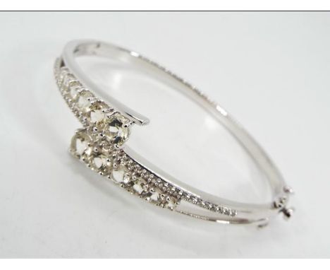 A Serenite &amp; White Topaz and Silver bangle ATGW 3.13ct, issued in a limited edition 1 of 39, Serenite stones round and va