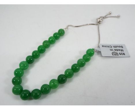 A 39.50 ct Burmese Green Jade and silver slider bracelet issued in a limited edition 1 of 100, size of each stone 6 mm x 6 mm