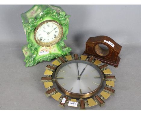 A mid 20th century Metamec wall clock, a ceramic cased Ansonia mantel clock (the case marked Wauneta) and a wooden clock case
