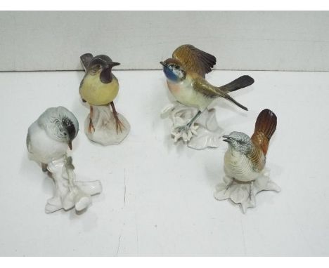 Karl Ens - Four Ceramic Birds. Amongst them a Wren, Grey Wagtail and a Blue Throat. Blue factory backstamp on all pieces. Wag