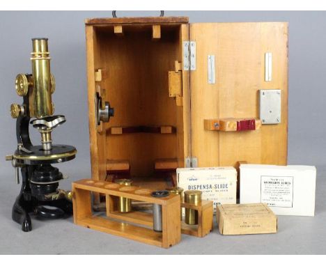 An Ernst Leitz lacquered brass and cast iron microscope c.1917, contained in fitted case.