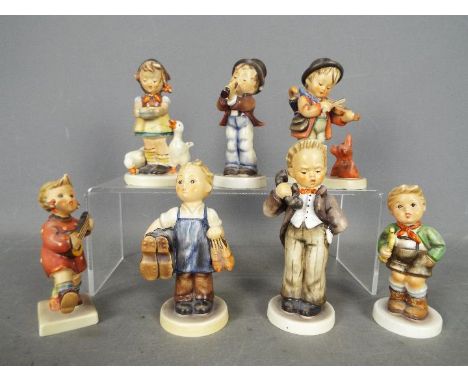 Seven Hummel figurines to include Boy With Telephone, Boy With Violin, Boy With Trumpet, Girl With Banjo and similar, largest