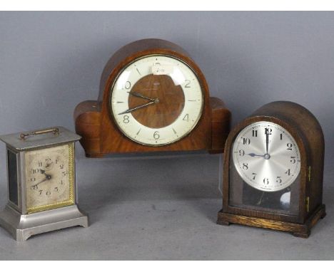 Three clocks to include a Bulle electric clock, a Smiths mantel clock and an alarm clock in the form of a carriage clock with