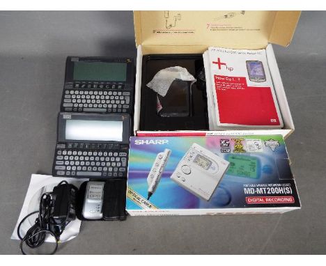 Lot to include a Sharp Minidisc Recorder (boxed), two Psion digital assistants and a boxed HP iPAQ hx2700 series pocket pc.