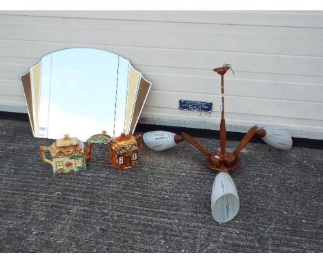 Lot to include a decorative wall mirror, approximately 45 cm x 68 cm, a three branch ceiling light and two cottage teapots. [
