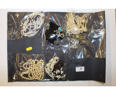 A collection of costume jewellery to include simulated pearl necklaces; earrings; brooches etc.