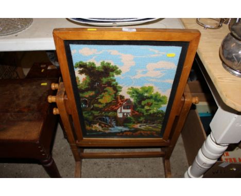 A needlework firescreen