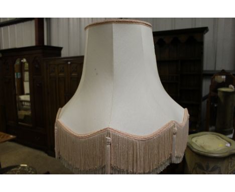 A mahogany table standard lamp and shade