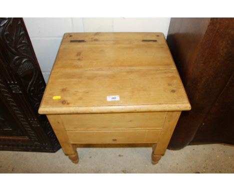 A stripped pine commode