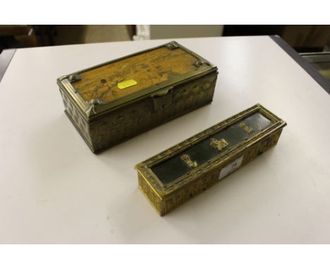 A gilt brass and green leather topped stamp box decorated with classical figures together with an Arts and Crafts brass cigar