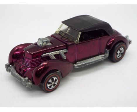 Hot Wheels - Redline - A rare Classic Cord in Magenta. The car appears in Near Mint condition with only a few minor marks. (T