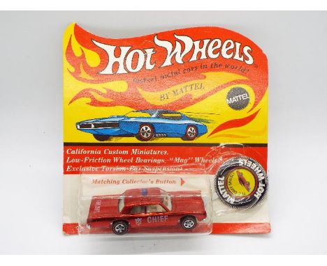Hot Wheels - Redline - An unopened original carded Fire Chief Cruiser Plymouth Fury in Red. The car appears in Mint condition