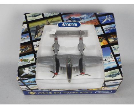 Armour Collection - A boxed diecast 1:48 scale Armour Collection (Franklin Mint) B11B279 P-38 Lightning. The model appears to