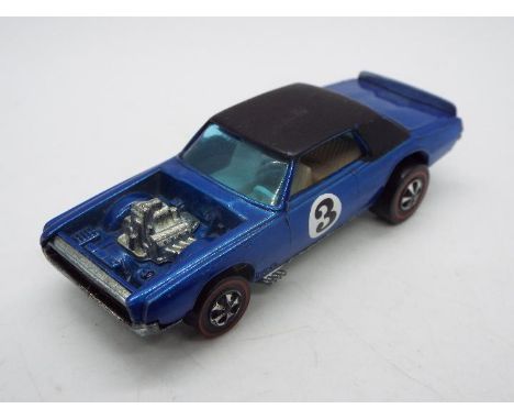 Hot Wheels - Redline - A TNT-Bird in Blue. This Hong Kong made example in Blue appears in Near Mint condition with only a few