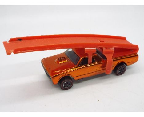 Hot Wheels - Redline - Sky Show - A Custom Fleetside Sky Show truck in Orange which appears in Near Mint condition with only 