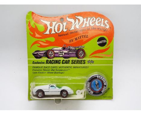 Hot Wheels - Redline - An unopened original carded Ford J-Car in Enamel White. This Hong Kong made model appears Mint on a Go