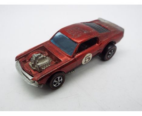 Hot Wheels - Redline - A Mustang Boss Hoss in Red. This Hong Kong made example appears in Good condition with signs of play u